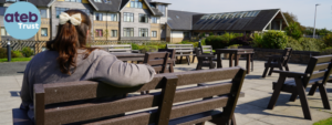 Person on bench overlooking Kensington Court